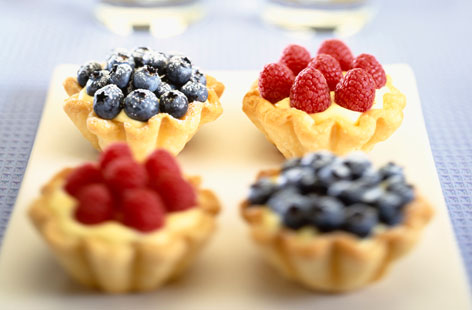 These petite berry tarts are little slices of summer. Vanilla-infused milk makes for a creamy base, while raspberries and blueberries provide tang. Perfect with a cup of tea, or a glass of Pimms - whichever you fancy!