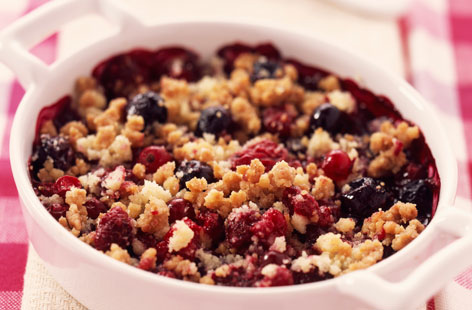 Crumbles can be made with many different sorts of fruit as this very berry crumble recipe demonstrates. Raspberries, strawberries, blueberries and redcurrants make up the filling of this classic pud'. Serve with custard or vanilla ice cream.