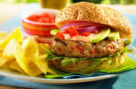 Irresistible chilli and red pepper chicken burger served with tortilla chips