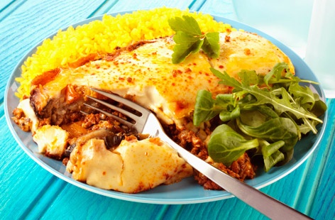Greek moussaka is a comfort food classic, richly flavoured with wine, oregano, cinnamon, coriander, and cumin. Made with layers of fried aubergine, warmly spiced-spiced lamb mince, and a creamy white sauce spooned on top.