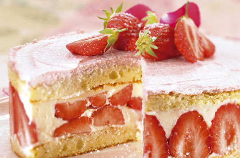 Light yet indulgent, this pretty-in-pink French gateau is the perfect summer dessert or elegant Mother's Day treat: Strawberries and cream, sandwiched between two light sponge cakes and topped with a pink cream icing.
