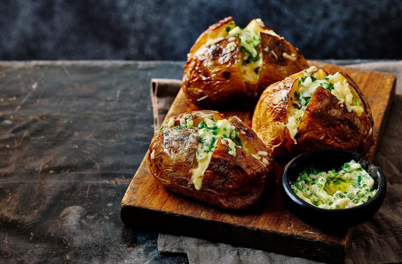 Herby baked potato with vintage Cheddar recipe