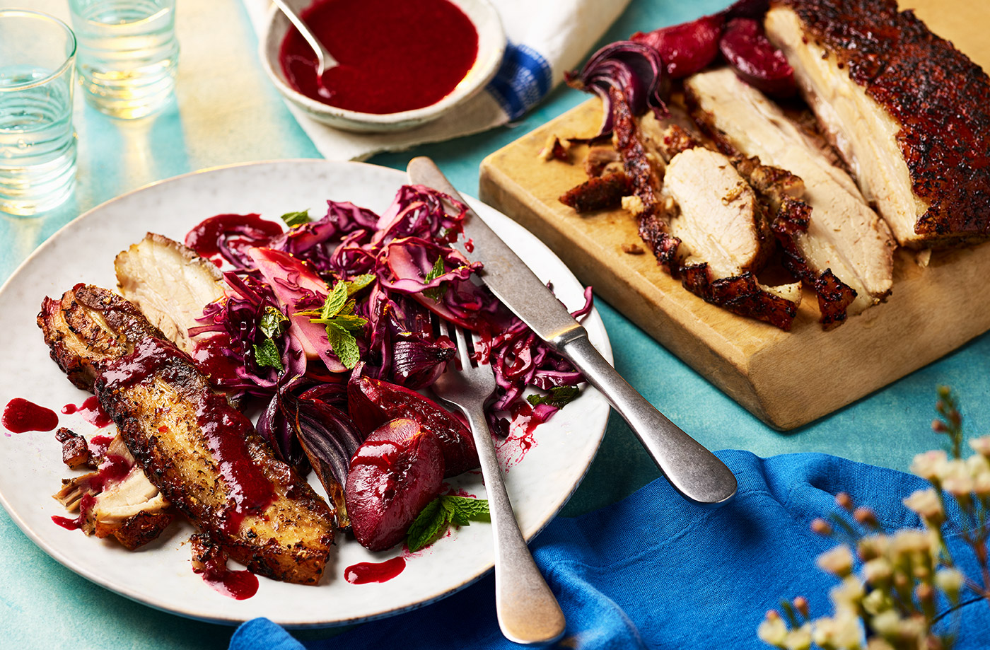 Slow-roast pork belly with sticky red onions and plum sauce recipe