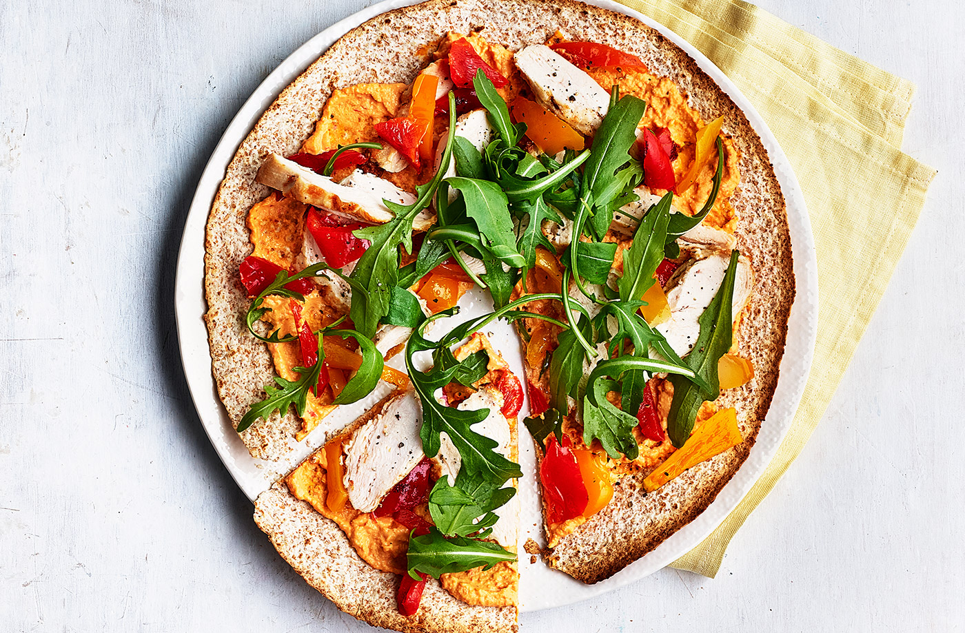 Spiced houmous and chicken 'pizzas' recipe