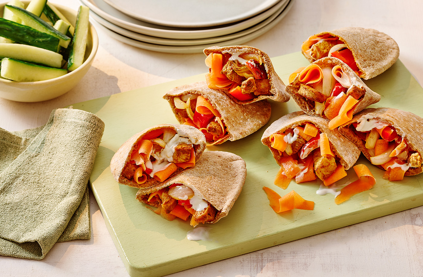 Spiced yogurt-marinated pork pittas recipe