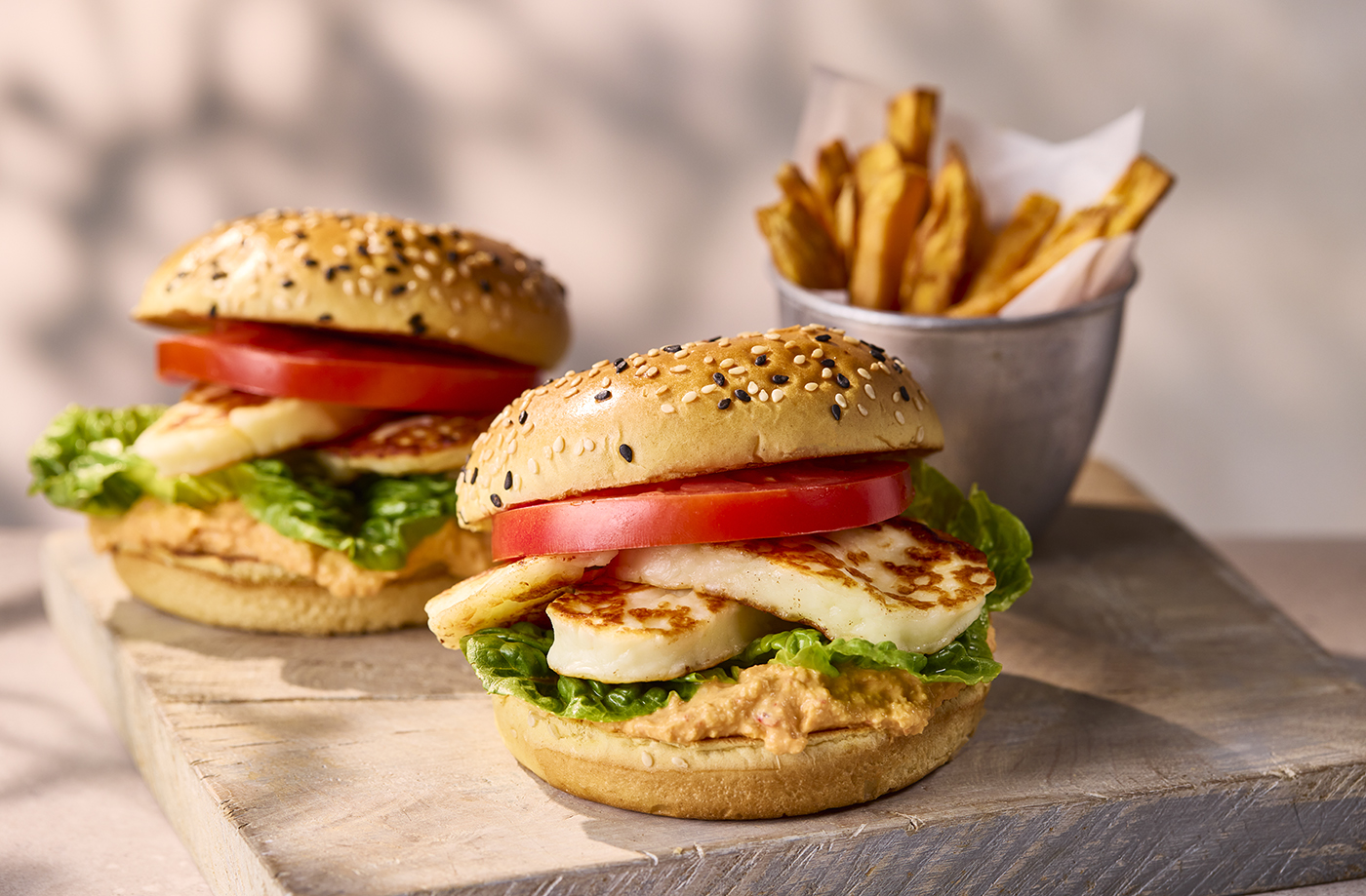 Halloumi burgers with red pepper houmous and sweet potato chips recipe