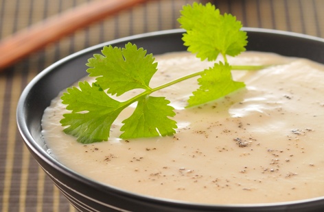 Give your cauliflower an exotic twist with this soup featuring fragrant coconut milk, punchy fish sauce and spicy chilli. To make, potato, cauliflower and softened onion are simmered together with fragrant ingredients before being blitzed and mixed with the coconut milk.