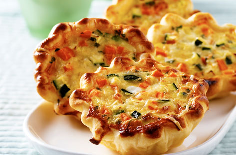 These mini vegetable quiches are filled with colourful chunks of carrot, courgette, and red pepper. Blind bake the cases first, add the filling, then return them to the oven for moreish results that will have you reaching for more than one.