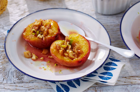 Gorgeously gooey caramelised peaches topped with salted nuts – a simple but delicious dessert