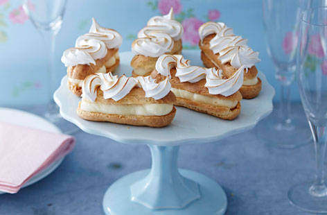 A citrus twist on classic French eclairs, using a gorgeous lemon curd cream to fill the light choux pastry buns. To make them all the more decadent the eclairs are topped with a dollop of whipped meringue and lightly toasted for a crisp, golden topping.