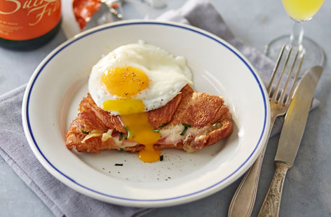 Croque Monsieur is essentially a toasted cheese and ham sandwich. Put a fried egg on top and you've got a Croque madame