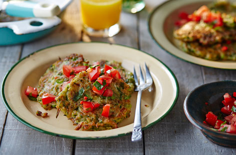 These tasty courgette fritters are perfect for packing up into a lunchbox or picnic hamper. They're spiced with cumin and coriander and served alongside a fresh tomato and chilli relish.