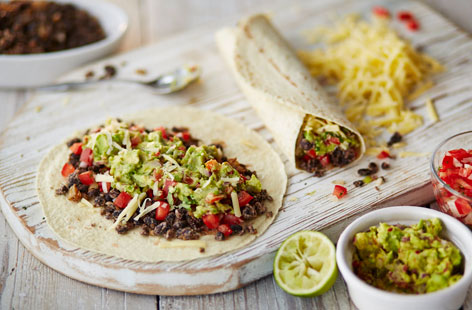 Making a Mexican-inspired burrito is a great way to spend your time. No matter how long it takes. Filled with plenty of vegetables and a blean bean filling that takes 24 hours to prepare, these black bean burritos are more than worth the effort involved.