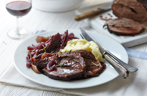Slow cooking beef brisket is totally worth the wait: it makes the meat incredibly tender and adds even more flavour. Red wine, red cabbage and red apples are a sumptuous combo when slow-cooked with the beef. Enjoy with olive oil mash.