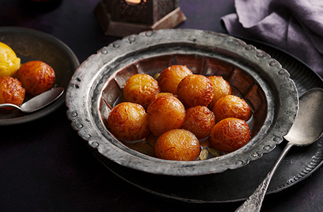 Like doughnuts, these balls are generously dunked in a cardamon and rose water syrup