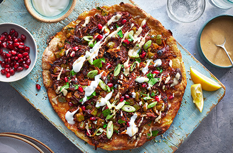 Make your own flatbreads with just 2 ingredients, then top your crispy base with topped with tender shredded lamb and vibrant veggies. Drizzle with tahini and lemon juice - a great way to use up Easter leftovers!