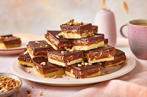 Whipping up a showstopping bake couldn't be easier with these shortcut ingredients. Simply, layer readymade shortbread with smooth caramel and melted chocolate, then scatter with flaky sea salt and chopped peanuts - these won't hang around for long!