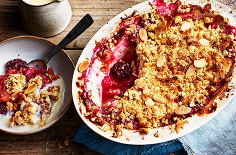 We’ve given classic crumble a grown-up spin with a nutty topping and spiced custard