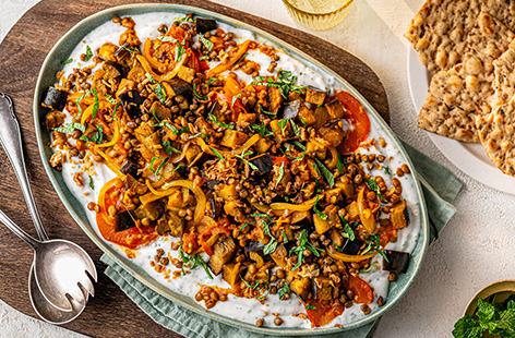 Borani is a Middle Eastern-inspired yogurt dip that Lucy first enjoyed on a holiday.​ She's given it her twist and topped it with a jammy aubergine, tomato and lentil stew.​ It packs in 2 of your 5-a-day and is high in fibre. Serve with flatbreads and dig in!