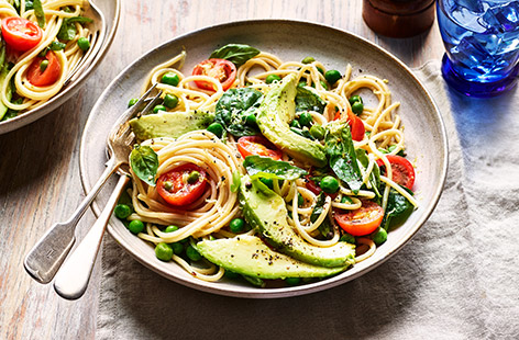 Slices of ripe avocado adds a luxurious, creamy texture to this veg-laden pasta dish