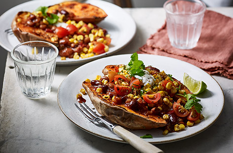 Soft baked sweet potato comes topped with a vibrant medley of veg, cooling yogurt and a kick of fiery crushed chillies