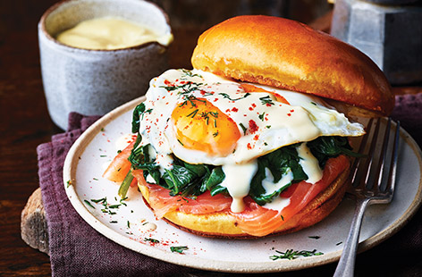 This brioche bun is fit-to-burst with spinach, eggs, and salmon
