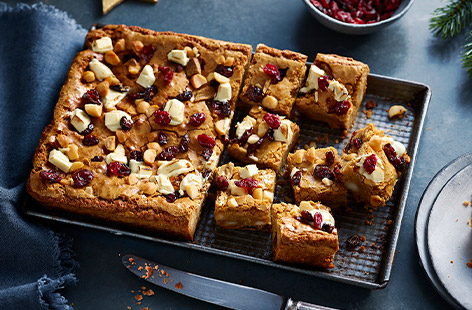 Indulge your sweet tooth this Christmas with this brown butter, cranberry and macadamia blondies recipe