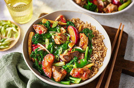 Skip the takeaway and rustle up this healthy pork stir-fry. It's tossed with a tangy homemade plum sauce and plenty of veg, all of which counts towards 2 of your 5-a-day. And it takes just 25 mins to come together, winner dinner!