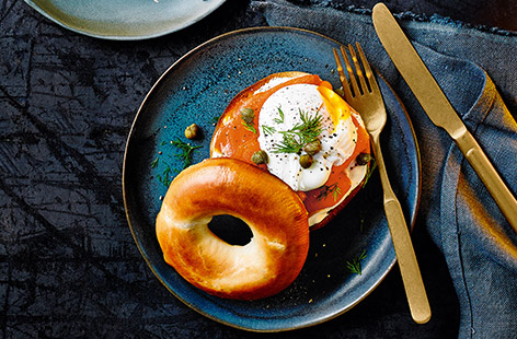 Toasted bagel halves topped with crème fraîche, smoked salmon, dill and a poached egg, the perfect breakfast or brunch