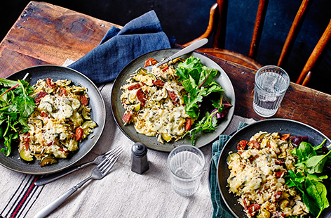 This veg-filled courgette and chorizo baked rice recipe is inspired by risotto, but with a whole lot less stirring! Crispy nuggets of chorizo and tender courgette are baked with rice under a melting cheesy topping for a hassle-free dinner idea.