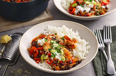 This simple chicken dinner – packed with caramelised onions and peppers – gets its heat from cajun spices and finely diced red chilli