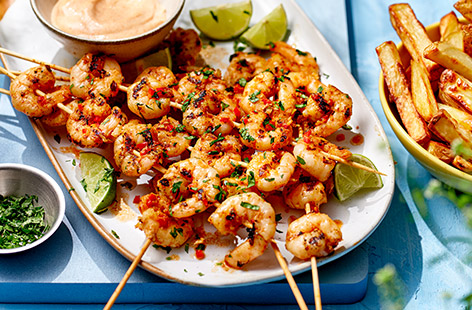 Chilli and lime is a classic combo for barbecued prawns and these skewers can be griddled or cooked over the coals, making them a versatile summer dish. This recipe includes baked potato wedges, try adding a green salad or seasonal veg for a balanced family meal.