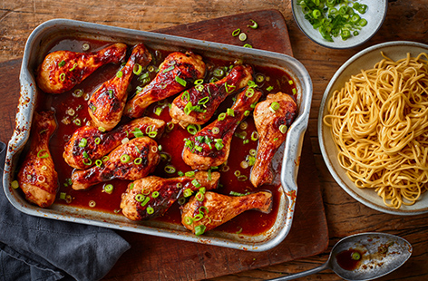 Chicken drumsticks are a great wallet-friendly way to feed the family - make the most of them in this sticky Chinese chicken drumstick traybake, with a glossy honey, ginger and soy dressing. Serve with simple noodles and scatter with spring onions.