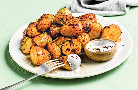 You'll love this smoky, spicy spin on classic roasties with a contrasting, cooling dip. Enjoy as a tasty side or a healthy snack – tuck in!