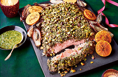 Classic stuffing flavours, sweet clementines and crunchy pistachios create a delicious crust for this simple yet special roasted salmon recipe. This is a feast for the eyes for your Christmas table, whether you serve it on the big day, New Year's Day or another occasion.