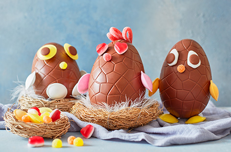 Looking for a way to keep the kids occupied this Easter? Set up an edible craft station and make these easy Easter chicks using large chocolate Easter eggs. Gather a selection of your favourite sweets and create your own adora