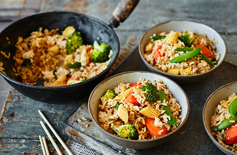 Turn a box of eggs and a packet of rice into a quick and easy dinner with this egg-fried rice recipe. Load up crispy rice with plenty of veg, ginger and garlic, then fry with beaten eggs for a wallet-friendly midweek meal.