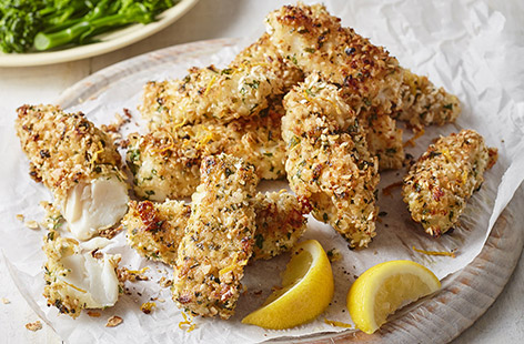 The whole family will love this fresh spin on fish fingers, coated with oats and seasoned with parsley, lemon zest and sesame seeds for extra crunch. Serve with greens for an easy dinner