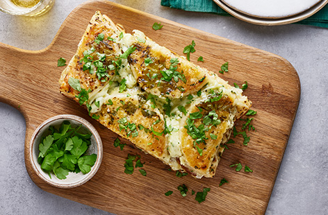 With melted garlic butter and two types of cheese, these garlic crumpets are perfect for party food, as a side dish, or even an indulgent snack
