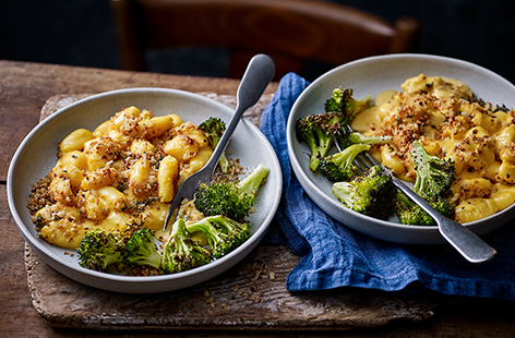 Try a twist on a classic with this gnocchi mac and cheese recipe. The traditional pasta shape is swapped out for pillows of soft gnocchi wrapped in a creamy two-cheese sauce and served with roasted broccoli for a comforting and cosy dinner for two.