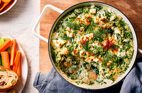 Blend the classic flavours of a Greek spanakopita together for a rich warm dip that's filling enough for dinner. Top with cheese and serve with crudités, crusty bread or a side of your choice. 