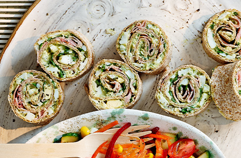 Vibrant in colour and taste, these simple green eggs and ham pinwheels are a picnic idea sure to impress the kids