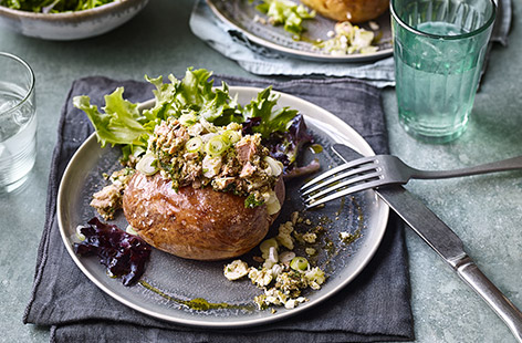 Try topping your jacket potatoes with a vibrant mixture of pesto, salad cheese, fresh parsley and spring onions
