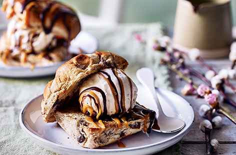 Toasted until golden and the sultanas dotted inside have begun to slightly caramelise, hot cross buns make the perfect vessel for a cooling scoop of vanilla in this recipe for hot cross bun ice cream sandwiches
