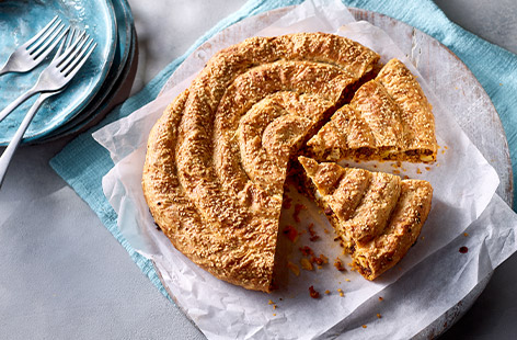 Looking for a flavourful and impressive dish for your next dinner party? Look no further than this delicious lamb filo swirl pie recipe! Featuring fragrant baharat seasoning, tender lamb mince, and crunchy pine nuts and raisins, this dish is sure to be a crowd-pleaser.