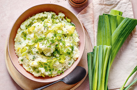 Make mash extra-special with buttery-soft leeks, Cheddar cheese and flat-leaf parsley. It's the perfect side dish to a roast or stew.
