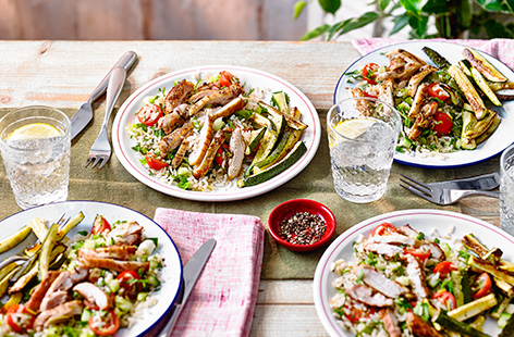 Need a new healthy dinner idea? Make this lemony grilled chicken recipe, served with a colourful herby brown rice salad and crispy courgette fries for a hearty summer meal. 