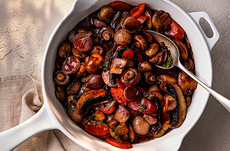 Packed with tender, meaty mushrooms, vibrant carrots and sweet shallots, this flavoursome and hearty mushroom bourguignon makes for an easy and delicious family meal.