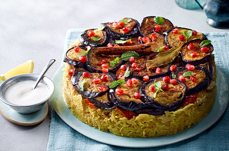 If you're looking to impress your guests with a Middle Eastern-inspired dish, look no further than Maqluba. Topped with juicy vine tomatoes and garnished with vibrant pomegranate seeds, this dish is as beautiful as it is flavourful.