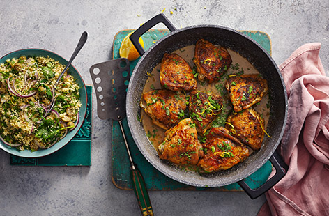 A light and fluffy couscous salad joins ras el hanout-seasoned chicken thighs in this Morocco-inspired dish